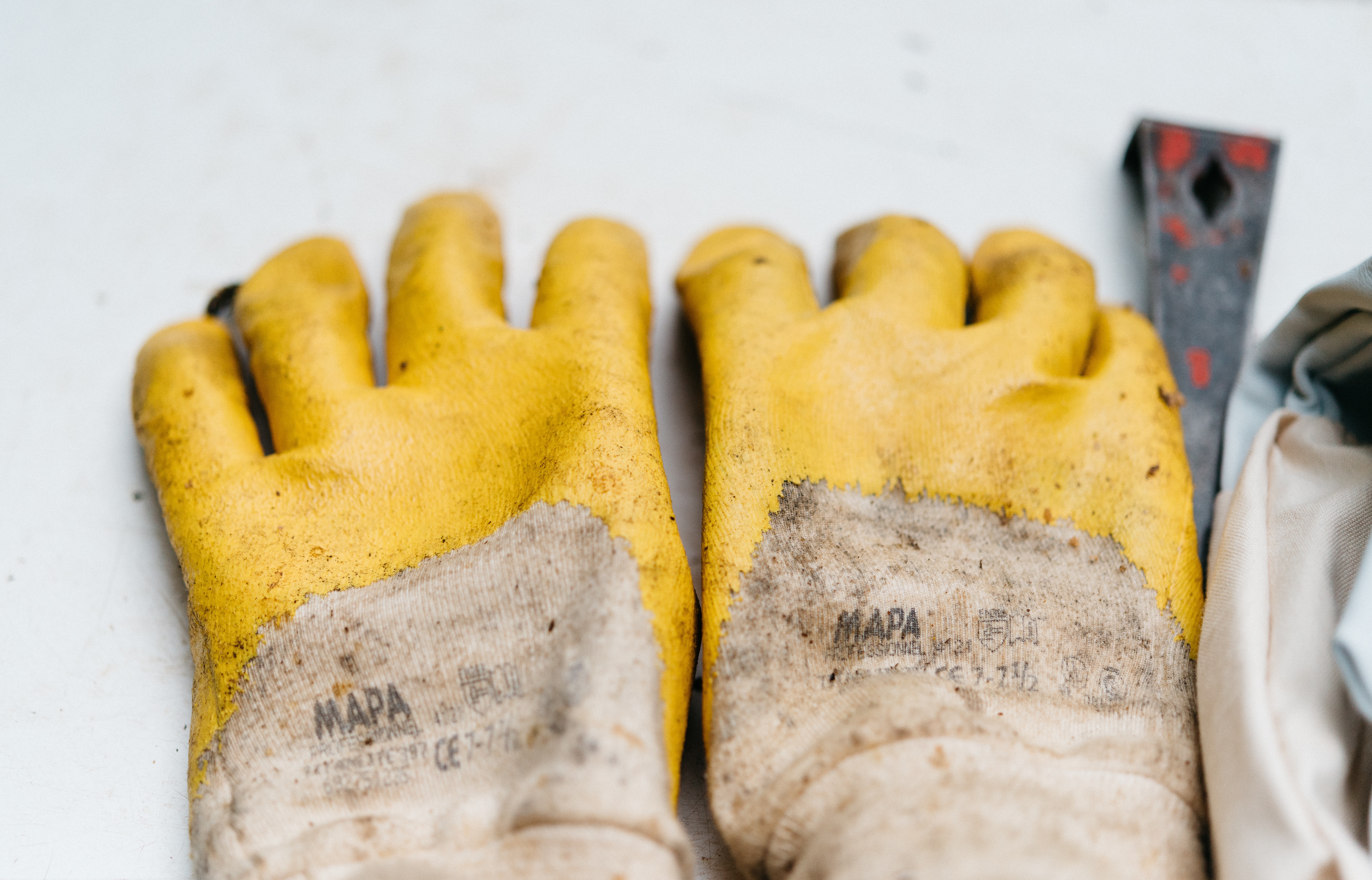 yellow gloves used by HVAC worker
